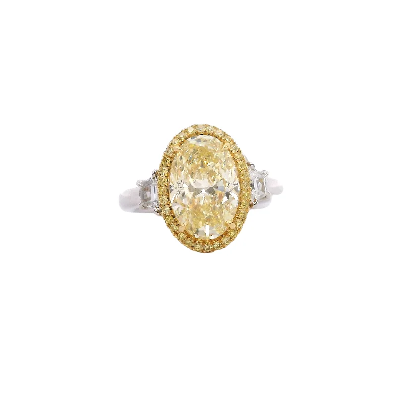 Modern gold engagement rings for ladies -Oval Fancy Yellow Diamond Platinum and 18kt Yellow Gold Ring